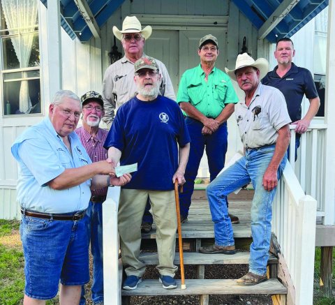 Pictured accepting the donation are Lavaca County 4-H Shooting Sports Volunteer Instructors Phil Guenther, Curtis Henrichs, Alan Rother, Andrew Marcak, Wayne Rother and Kevin Kubenka. Donor Warren Peloquin is pictured in the center.