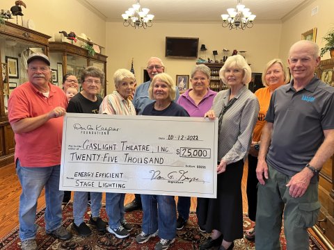Pictured, left to right, are Gaslight Board members Craig Hughes, Adriana Bridges and son, Ann Moseley, Sandy Machacek, Mike Patek, Linda Leist, Elaine Berkovsky, Toni Rogers, Meredith Hairell and David Kaspar representing the Don G. Kaspar Foundation.