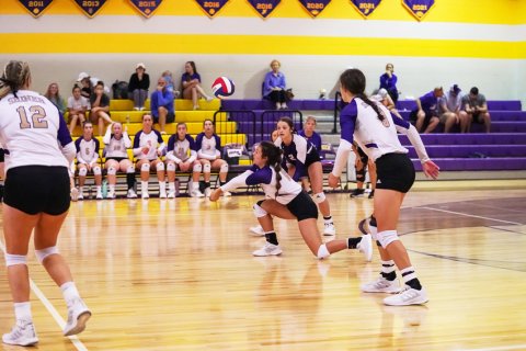 Riley Rainosek attempts to dig out a ball in Saturday's match against Schulenburg. Photo courtsey of Photos by Lori Raabe.