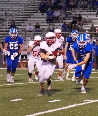 Zane Barta led St. Paul with 200 rushing yards and two touchdowns against Sacred Heart. Photo courtesy of Howard Esse.