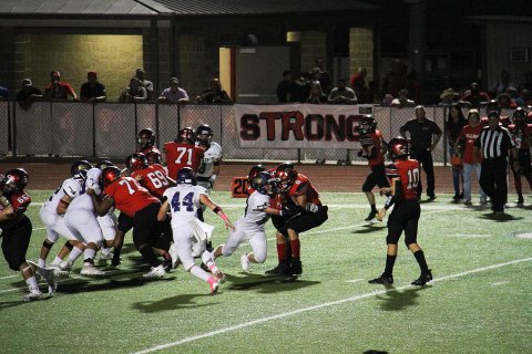 Jake Davidson makes a tackle while Hunter Knight comes in to assist. Photo courtesy of John Davidson.