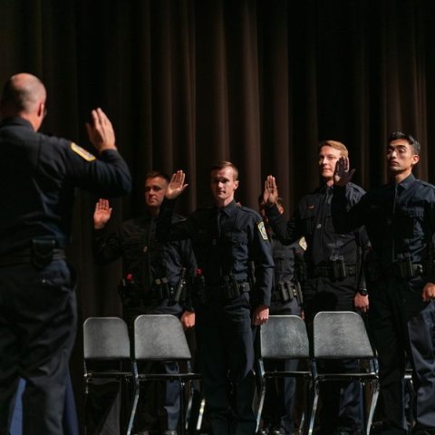 Matthew Herman accepts his oath as new police officer with the Bryan Police Department having recently completed Police Academy. 