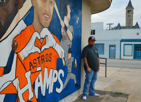 Bob Barrera poses in front of a mural dedicated to the Houston Astros outside his studio, Created, by Bob Barrera Originals, Nov. 11.  Photos by Hans Lammeman