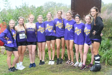 Shiner girls XC team. From left is Megan Winkenwerder (manager), Riley Rainosek, Eve Roberts, Callie Chrismon, Amelia Pohler, Erin Pustka, Brinley Ramirez, Molly Kollaus and Lily Gipson (manager). Photo by Mark Lube.