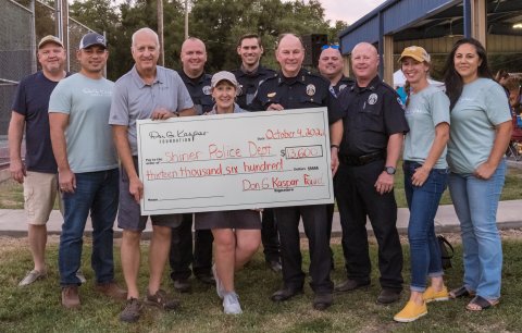 Pictured are, left to right, Greg Chumchal, James Taumoepeau, Douglas Kaspar, Sgt. James Whited, Laura Kaspar, Officer Greg Proske, Chief Kevin Kelso, Sgt. Kevin Kelley, Officer Michael Hudson and Hali Kaspar.