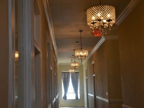 Chandeliers line the hallway upstairs at the old National Bank building in downtown Yoakum.
