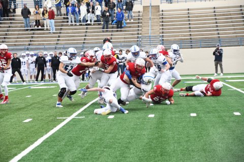 Zane Barta fights for yardage. Photo by Mark Lube.