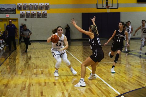 Kailey Boedeker finds her path blocked in Jan. 3’s Shiner vs Flatonia game in Shiner. Photo by Mark Lube.