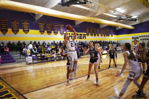 Megan Winkenwerder shot attempt in the first half. Photo by Mark  Lube.