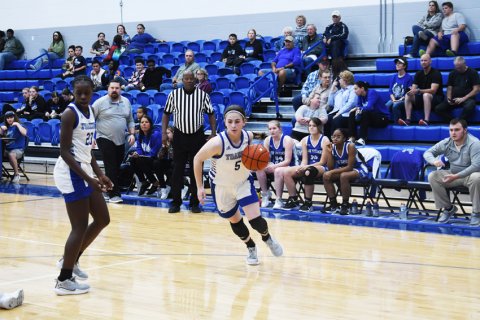 Olivia Fojt drives the ball inside the circle against Rice. Photo by Mark Lube