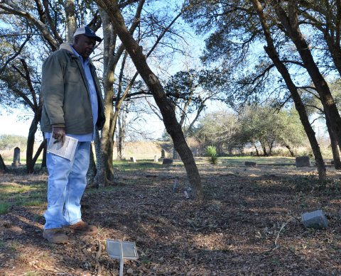 David Mitchell visits the grave of his great-grandmother Salle Mae Granger at the Yoakum City Colored Cemetery last Wednesday, Jan. 25. 