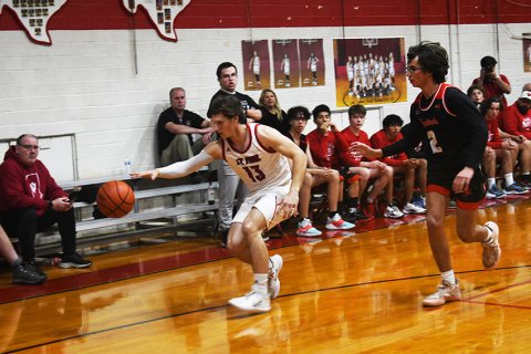 Fisher Davis works to retain possession of the ball. The senior scored four points. Photo by Mark Lube.