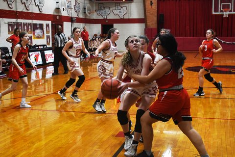 Riley Mozisek eyes the basket against Concordia. She led St. Paul with 11 points. Photo by Mark Lube.