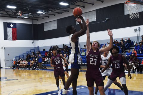Xavier Barnett with an inside jump shot against the Brahmas. Photo by Mark Lube.