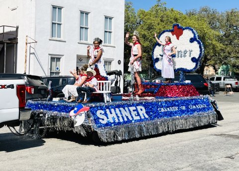 The Shiner Chamber float passes through downtown Goliad during the Rodeo Parade.