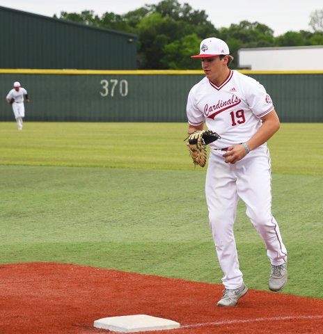 First baseman Nate Boedeker races to the bag to beat out the Bracken runner during one of his 10 putouts in St. Paul’s district opener against Bulverde Bracken Christian on March 29. Photo by Mark Lube.