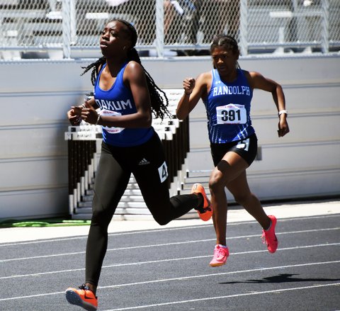 ayana Phillips races ahead of UCR to win the 400-meter dash Saturday in the Region IV-3A meet in Seguin. Photo by Mark Lube.