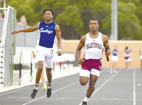Damarion Austin anchors the second place sprint relay. Chuck Grafe/Tribune-Herald