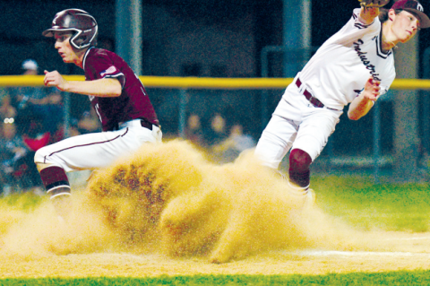 Josh Griffin scores on a wild pitch in the loss to Industrial Friday night.