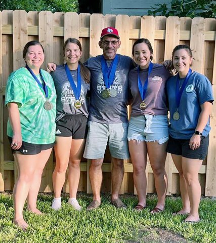 The Pokluda softball family. From left is Bethany Barton, Stefany Pokluda, David Pokluda, Mallory Pokluda and Emily Siegel. Not pictured is Melissa Pokluda. Photo courtesy of David Pokluda.