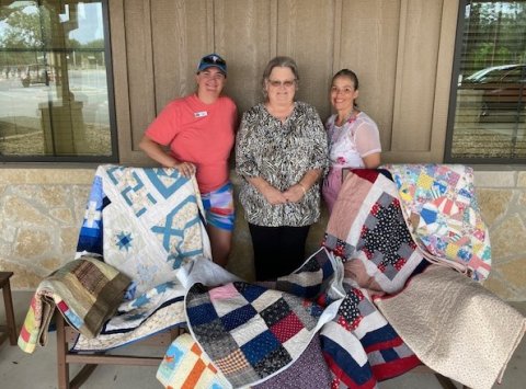 Pictured are, left to right, Torye Gleitz, Operations Coordinator at Morgan’s Wonderland, Janet Ferguson, Shiner Heritage Quilters President and Diane Price, Executive Administrative Assistant. 