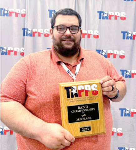 Jake Heck, band director at both Shiner St. Paul and Hallettsville Sacred Hearts Catholic School, brought home to 2022-23 Fine Arts Director of the Year Award