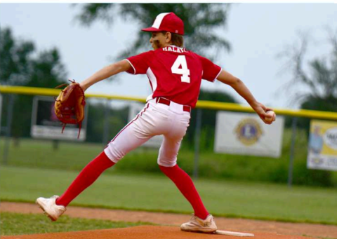 Will Halata delivers the first pitch in the game Monday night.