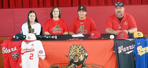 Jackson Ulcak officially signed with University of Houston-Victoria baseball program on July 10 at the St. Paul gym in front of family, friends, coaches, school officials and other guests. From left are Lexie Ulcak, Kimberley Ulcak, Jackson Ulcak and Russell Ulcak. Photo by Mark Lube.