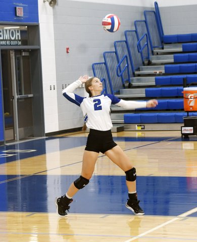 Macie Blakeney serves in the match against Gonzales. Photo by Mark Lube.