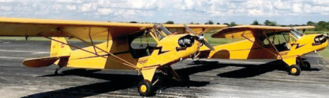 These are the 1946 Piper J3 Cubs, just like the model that’s getting raffled off. The Barnstormers Museum has three of these planes.
