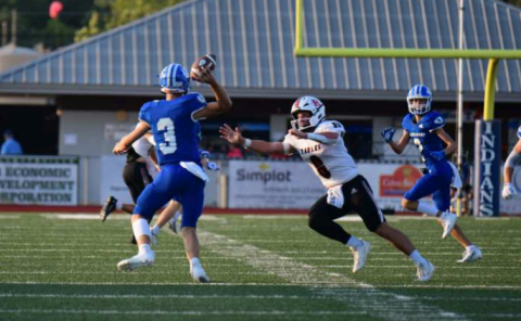 Quarterback Andrew Steffek completes a 19-yard pass to Hudson Kutac (2) on the Indians’ first play from scrimmage. Chuck Grafe/Tribune-Herald