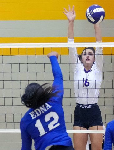 Morgan Lenehan gets close to blocking an Edna shot Aug. 15 in Shiner’s three-set win over the Cowgirls. Photo by Howard Esse.