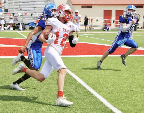Blaine Humes gains a few yards on one of his seven carries. He totaled 77 yards on the ground and one touchdown in St. Paul’s win over Dallas CHE Saturday in Temple. Photo courtesy of Brian and Louann Heinsohn.