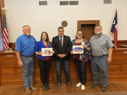 The winners of the “I Voted” and “Future Voter” coloring sticker contest, sponsored by the Lavaca County Elections Department, were Daniel Hernandez, 5th grade student at Moulton ISD, and John Moore, 10th grader at Shiner HS. Pictured are Commissioner Kenny Siegel, elections administrator Amy Kloesel, County Judge Keith Mudd, elections voter registrar, Brandy Stuckey, and Commissioner Dennis W. Kocian. Photo by Jimmy Appelt  