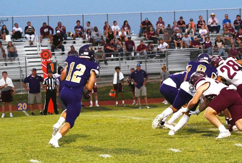 Carson Schuette and Trace Bishop (right) block for running back Rakin Wallace in Shiner’s district opener at home to Ganado last Friday. The Comanches play at Bloomington this Friday. Photo by Mark Lube.
