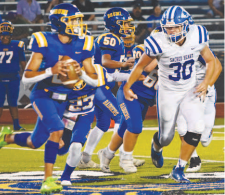 Josh Terry chases down Bruni quarterback Albert Esquivel. Melissa Kutac/Tribune-Herald