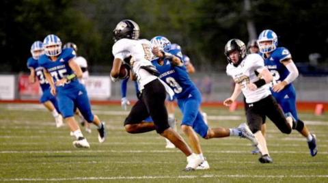 Freshman Layne Sevcik chases down Northland’s Rome Stanford in the third period. Chuck Grafe/ Tribune-Herald