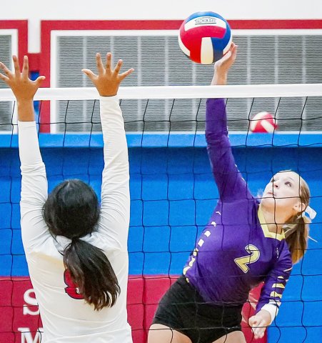 Callie Sevcik makes a play at the net against Nixon-Smiley. She had two kills, four digs, one assist and a block in the match against the Lady Mustangs. Photo by Howard Esse. 
