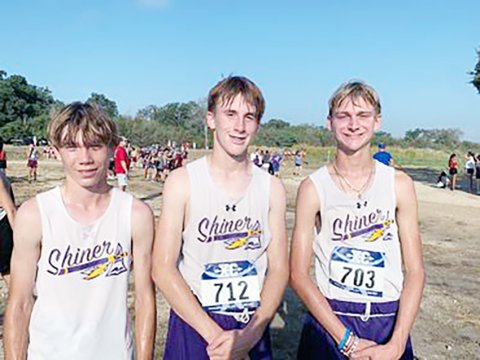Shiner boys cross country runners at Gonzales Invitational. From left is Caleb Cowan (No. 59), Landen Christensen (No. 48) and Boe Boehm (No. 42). Photo courtesy of Michelle Winkenwerder. 
