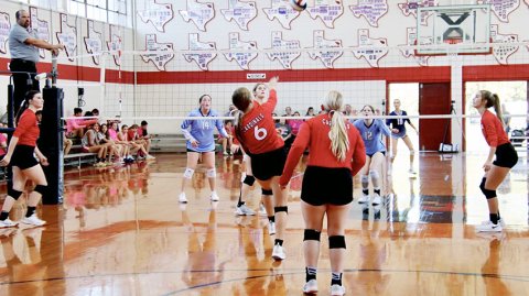 Avery Pesek (second from left) plays a ball on the net with Sam Moeller (left), Maurin Knesek (second from right) and Dallyn Pesek (right) also on the play during last week’s home match vs  Bulverde Bracken. Photo courtesy of Brian and Louann Heinsohn.