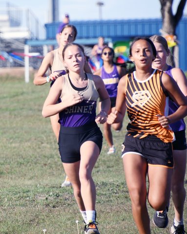 Emma Joslin (foreground), Erin Pustka (background) and the rest of their Lady Comanche teammates along with Comanche Boe Boehm will be competing at the regional XC meet next Tuesday. Photo by Mark Lube.