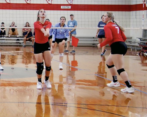 Dallyn Pesek (left) and Faith Machart in action during a recent St. Paul home match. The Lady Cards hosted Sacred Heart  Tuesday of this week. Photo courtesy of Brian  and Louann Heinsohn.
