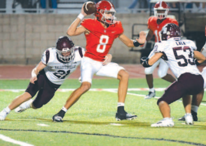 Linebacker Carter Blaha (21) and defensive end Austin Lala pressure Columbus’ Adam Schobel. Dean Kibler/Eyewitness News