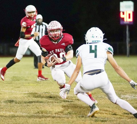 St. Paul senior running back Zane Barta faces down Austin Brentwood’s Griffin Smith Friday night at Comanche Stadium. Barta rushed for 125 yards as the Cardinals won 28-27. Photo by Photos by Lori Raabe.