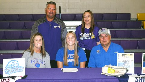 Shiner senior catcher Paeden Vincik’s softball days will be extended past the end of the current school year for at least two more years as she will play at Galveston College. She signed with the Whitecaps last Thursday. Sitting from left are Sherri Vincik, Paeden Vincik and Chuck Vincik. Standing from left are Shiner head softball coach Jason Keller and assistant coach Anatascia Rehak. Not shown is retired assistant coach Ray Neal. Photo by Mark Lube.