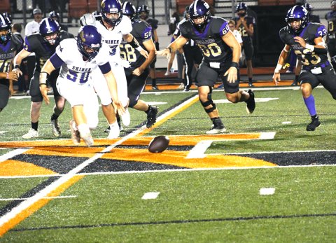 Comanche defensive linemen Barrett Shelton (50) eyes this first-quarter fumble by Hornet quarterback Desi Cantu. Shelton successfully recovered the ball at the Holland 46.  Photo By Mark Lube.