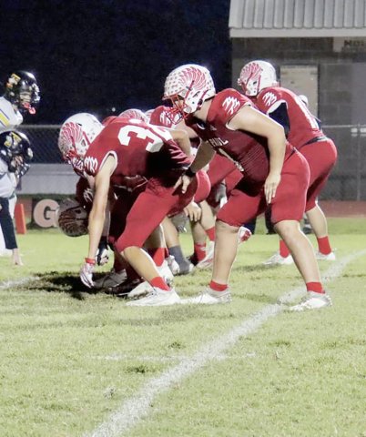 The St. Paul Cardinals line up for point-after play during the bi-district round Friday night against Fort Worth Temple Christian at Comanche Stadium. Photo courtesy of Brian and Louann Heinsohn. 