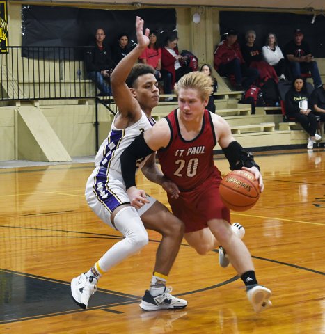 Zane Barta attempts to dribble past a Weimar defender Friday morning at the Round Top-Carmine Tournament. Photo by Mark Lube. 