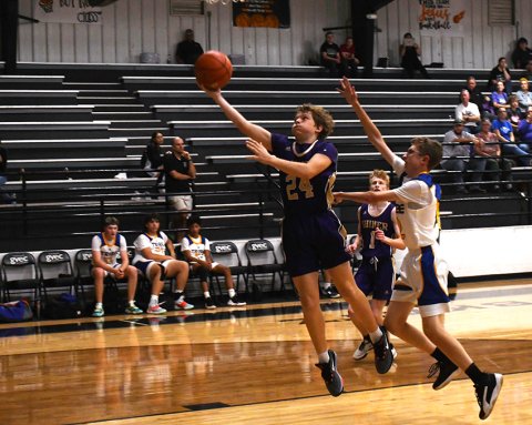 Cauy Herman tries for a layup Friday against Bastrop Tribe in the Katz Klassic Tournament. He scored nine points in a 77-25 Shiner win. Photo by Mark Lube.