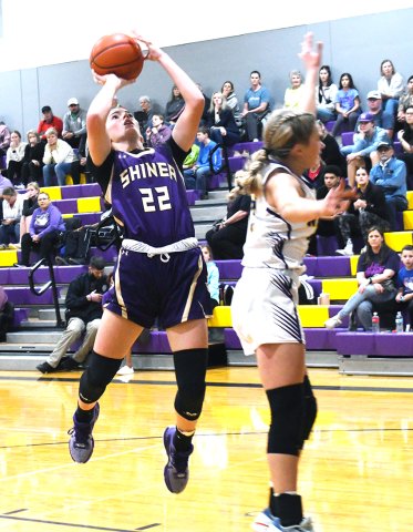Addy Siegel launches a shot from the paint in the first quarter against Weimar. The sophomore led Shiner in points with 17 and had the Lady Comanches’ lone triple. Photo by Mark Lube.